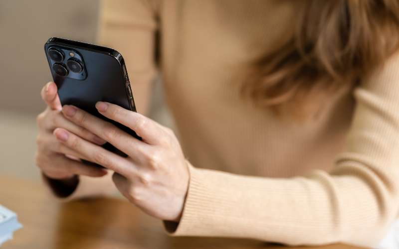 woman texting on phone 